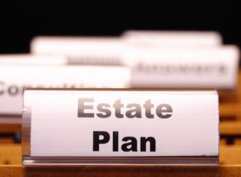 real estate plan on business folder showing buy a house concept